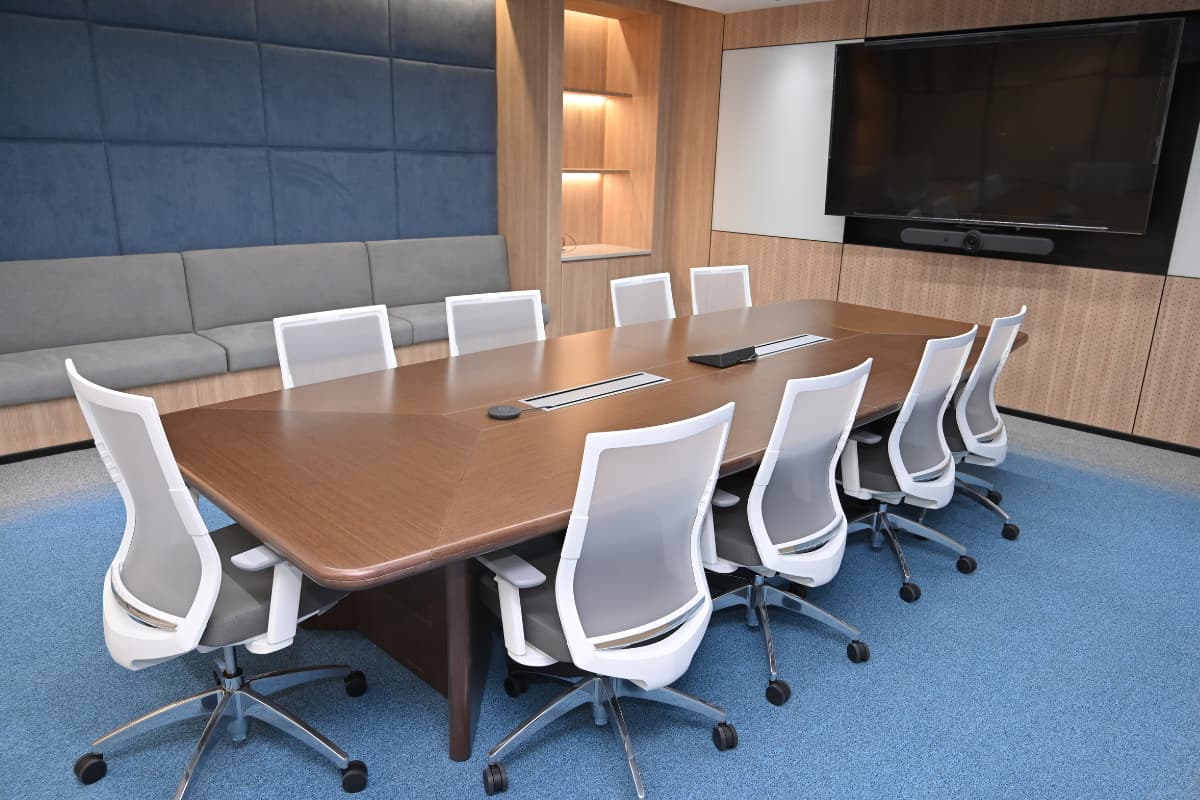 a boardroom with chairs and a table