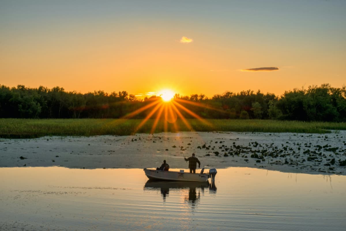 a-cannoe-on-the-lake-at-sunset